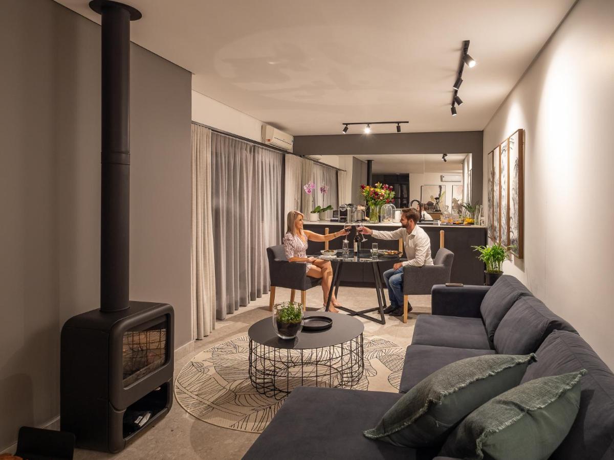 Menlyn Boutique Hotel Pretoria-Noord Exterior foto A living room with a fireplace